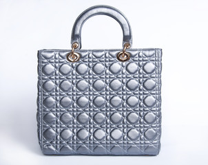 Woman's bag isolated dropping shadow on white surface