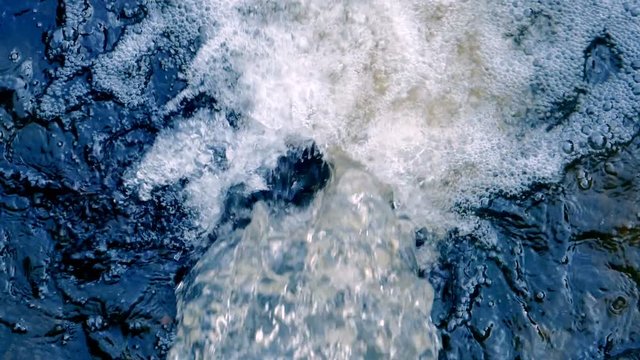 Running of water stream from waterfall, top view
