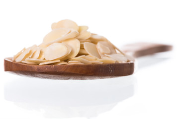 Sliced almonds isolated white background