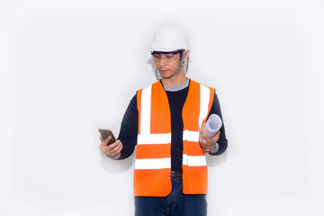 Asian engineer wearing safety helmet and safety glasses holding smartphone on white background