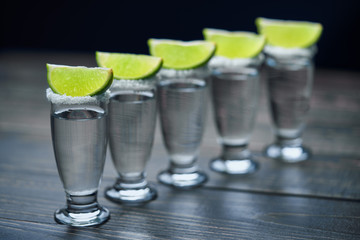 Glasses of silver  tequila with lime,selective focus