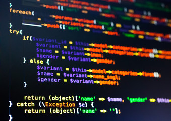 Extreme close-up of php code on the dark background