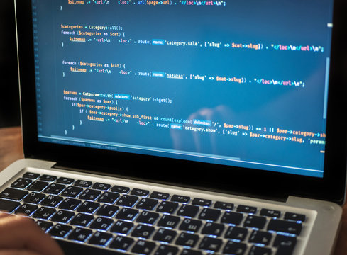 Computer code on laptop (web developing) close-up