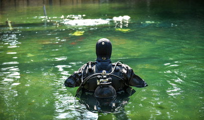 Scuba diver worker is over viewing underwater archaeology works.