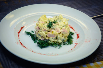 process of preparation of salad by the child at school of young cooks