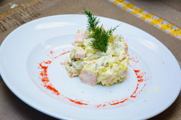 process of preparation of salad by the child at school of young cooks
