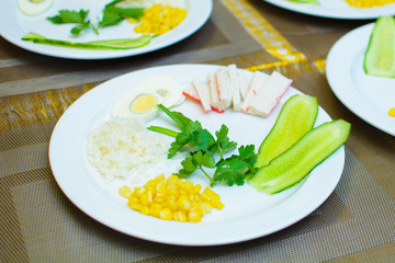 process of preparation of salad by the child at school of young cooks