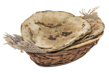 Rajasthani Bajra Roti or Bajri Roti in Basket isolated on White Background