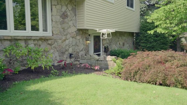Drone or quadcopter landing in an American home gardens