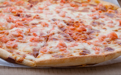 Pizza with shrimps in a box