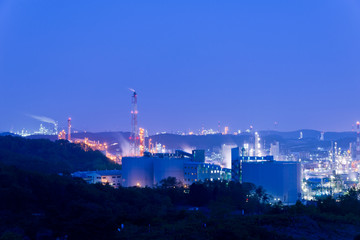 Aerial view Oil refinery.Industrial view at oil refinery plant form industry zone with sunrise and cloudy sky. and Petrochemical background sunset.