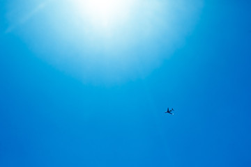 Fototapeta na wymiar Plane in blue sky.