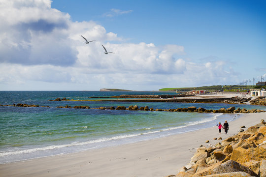 Photo of a beautiful scenic sea and sky landscape. View of ocean scenery. Beach and promenade, West coast of Ireland, Galway, Salthill, Atlantic ocean. Sea shore line