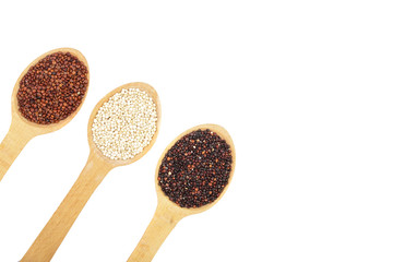 Black red white quinoa seeds in wooden spoon isolated on white background with copy space for your text