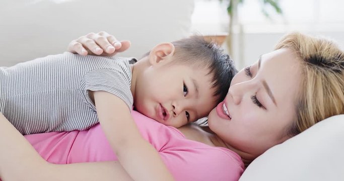 son lying on mother body