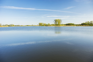 Blue lake and sky separated by a horizon