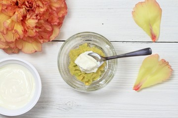 Facial or hair mask from avokado and yogurt. Alternative medicine concept, homemade mask from edible ingredient,