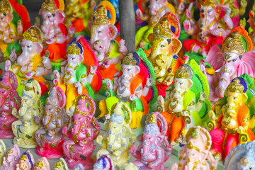 Fototapeta na wymiar Ganesh Chaturthi also know as Vinayaka Chaturthi is the Hindu festival, God Ganesha Statue Made of Clay And Coated with Ceramic Colors, Handmade Artistic Effects, Beautiful Artifacts