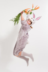 Excited bunny girl on light background