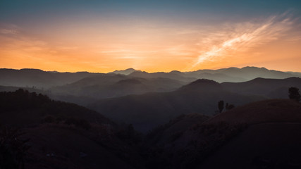 Landscape of forest mountains on sunset