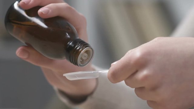 Woman pouring viscous liquid, treatment of kidneys, heart disease, bronchitis