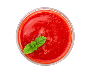 Tomato juice in glass with a mint leaf isolated on white background. Top view. Flat lay
