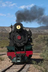 Quorn South Australia, View of approaching restored steam engine with semi arid landscape in background