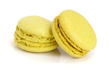 yellow macaroon isolated on white background closeup