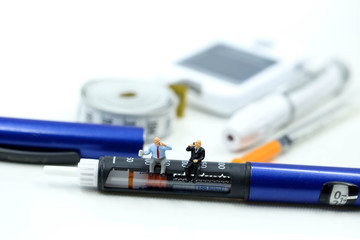 Miniature people : Doctor and Patient with Insulin pen ,Diabetes equipment ,glucose level blood test,Diabetes concept