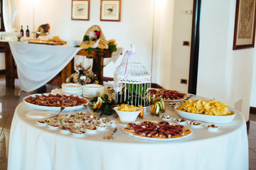 restaurant table prepared with tasting dishes for an aperitif for a wedding party gala dinner