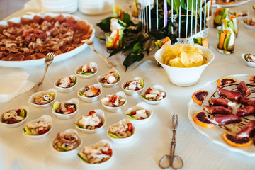 restaurant table prepared with tasting dishes for an aperitif for a wedding party gala dinner