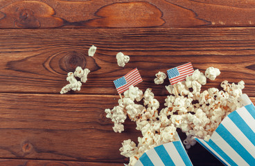 Salt popcorn on the wooden table