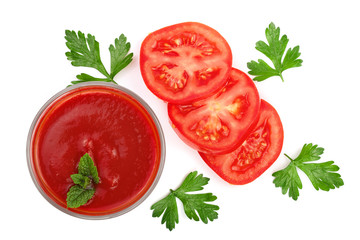 Tomato juice in glass and tomatoes with parsley leaves isolated on white background. Top view. Flat lay