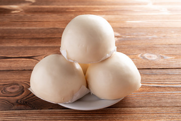 traditional Chinese buns on a wood table