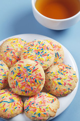 Cookies with colorful sprinkles and tea