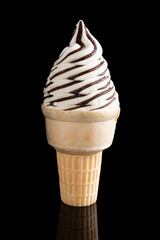 ice cream cone on a black background with reflection