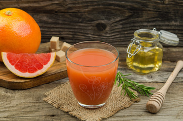 Healthy organic grapefruit. A glass of fresh grapefruit juice