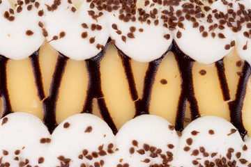 Close up of delicious cream cake with chocolate