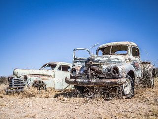 Abandoned classic cars rusting in Namib desert, Namibia