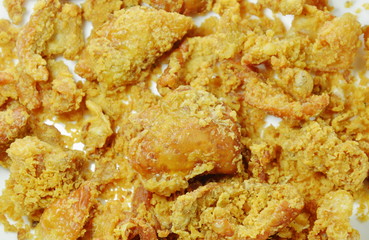 deep fried chicken skin with salt and pepper on white plate