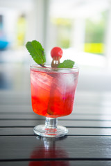 fresh drink punch juice with ice, cherry and mint