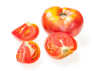 Cut out slice from red juicy tomato. Isolated over white background