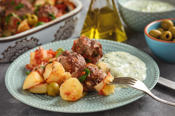 Kofte , beef meatballs, baked with vegetables.