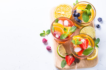 Cold summer drink assortment. Top view on white.