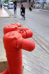 red standpipe, water supply or fire hydrant system by street for emergency purposes