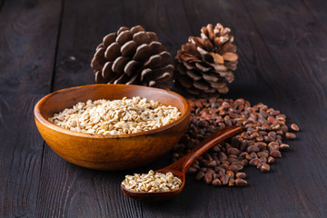 Cedar nuts and cones on wooden table
