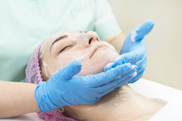 Massage and facial peels at the salon using cosmetics 