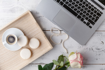 Vintage wooden tray with porcelain teacup and pink flowers