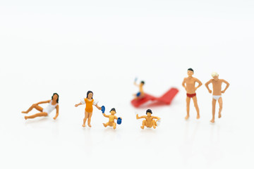 Miniature people : children in swimsuit and friends. Image use for holiday, vacation concept.