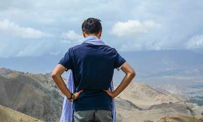 Young traveler looking at mountains